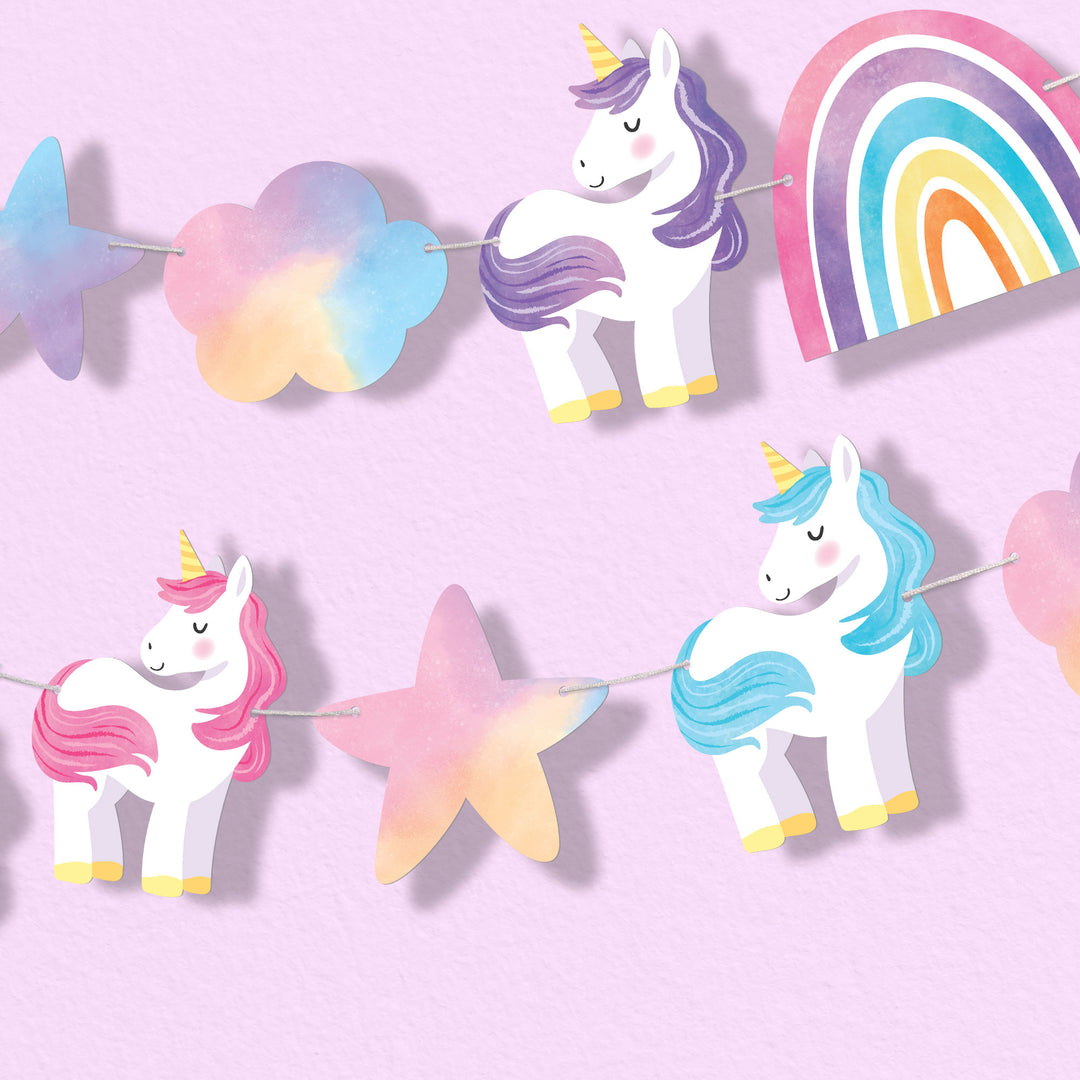 Unicorn and rainbow-themed party banner on a pink background