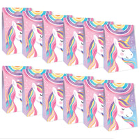 Unicorn-themed party favor boxes with colorful designs on a white background