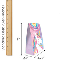 Unicorn-shaped door stopper with dimensions and a ruler for scale on a white background