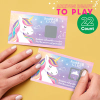 Unicorn-themed scratch-off game cards with a hand interacting with them on a yellow background.