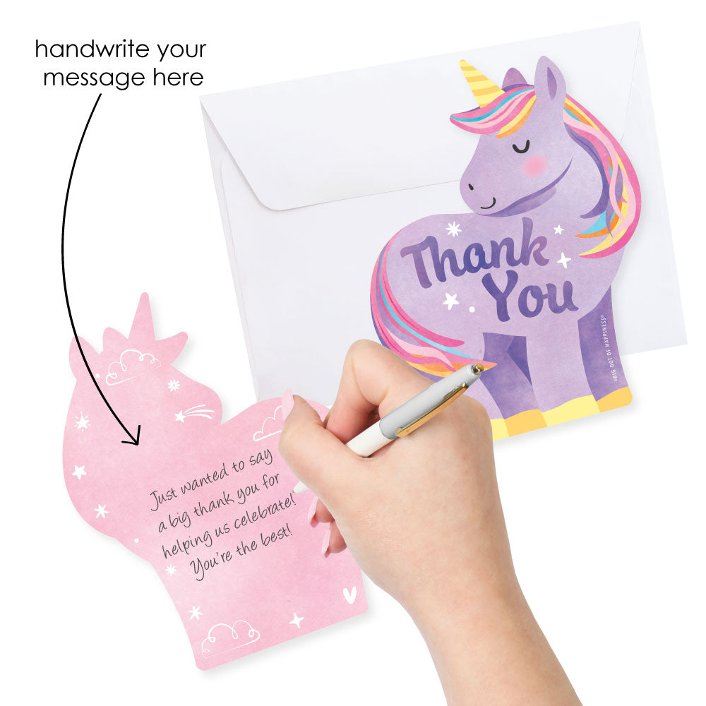 Unicorn-themed thank you card with a hand holding a pen and an arrow pointing to it, on a white background.