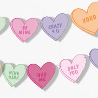 Colorful heart-shaped Valentine's Day banner with various messages on a white background