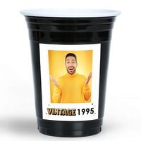 Black Custom party cup with a photo of a man in a yellow sweater and 'Vintage 1995' text on a white background