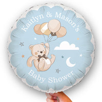 Round blue balloon with we can bearly wait teddy bear, balloons, and text for a baby shower