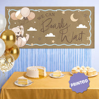 Teddy bear baby shower banner styled behind dessert table