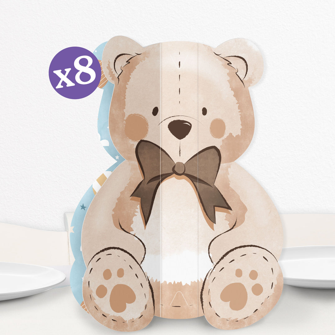 A teddy bear-shaped 3D  we can bearly wait centerpiece made of cardstock with blue-patterned sides, designed for baby shower or bear-themed parties.
