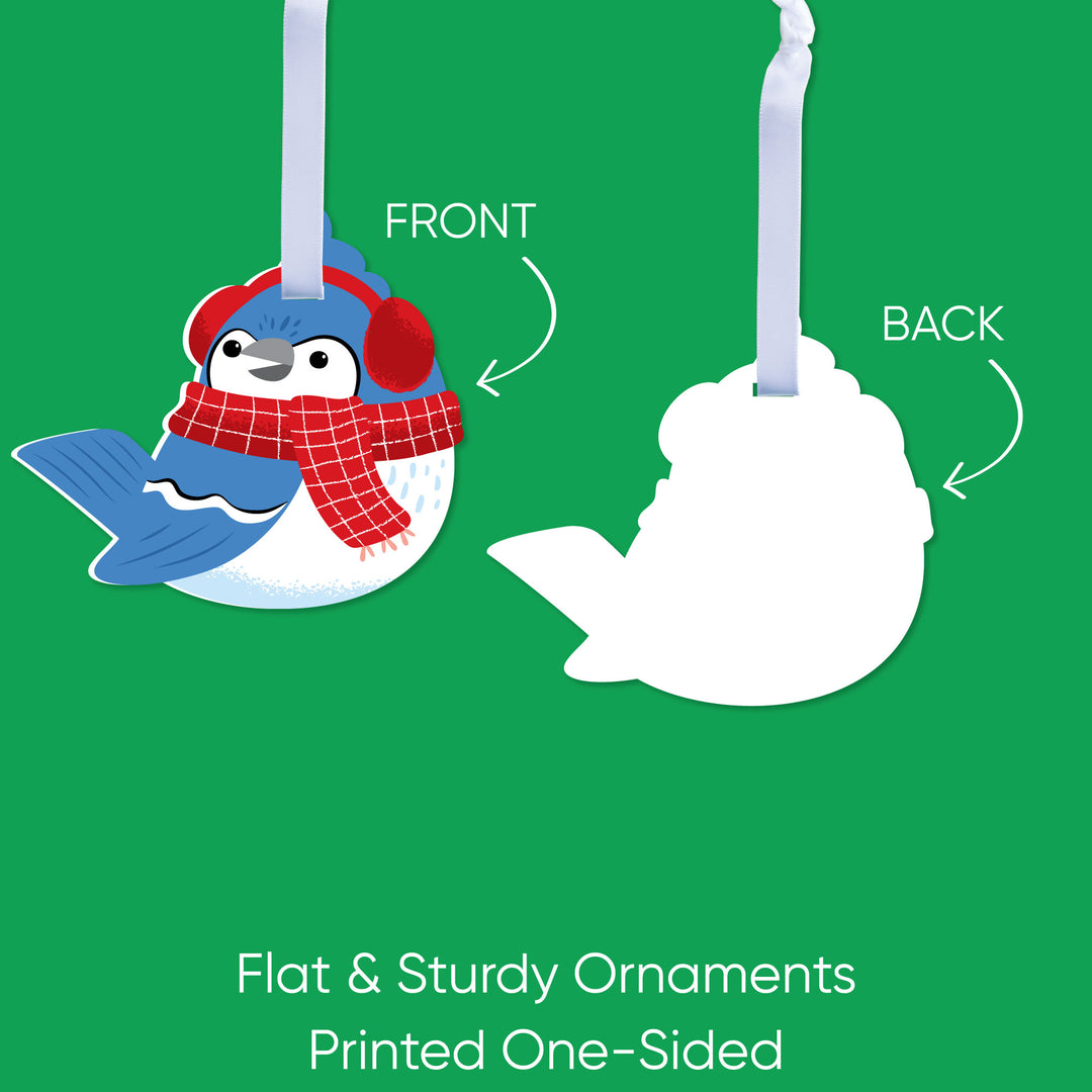 Illustration of a penguin ornament with a red scarf and blue hat on a green background, showing front and back views.