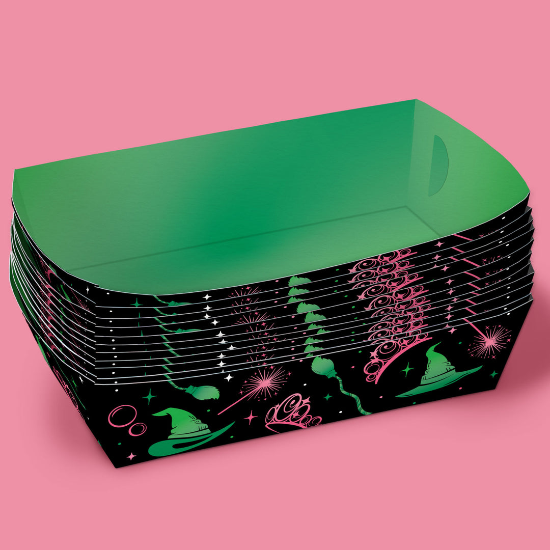 Stack of wicked party green paper plates with a black and pink design on a pink background