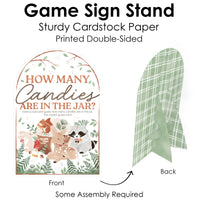 Game sign stand with front and back views, featuring text and illustrations of baby shower forest animals.