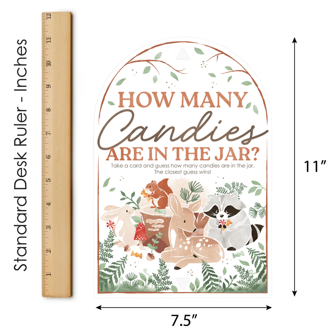 Woodland-themed game card with animals and text, shown with a ruler for scale.