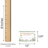 Measurement chart showing a card labeled 'Guess How Many Candies Are in the Jar!' next to a standard desk ruler.