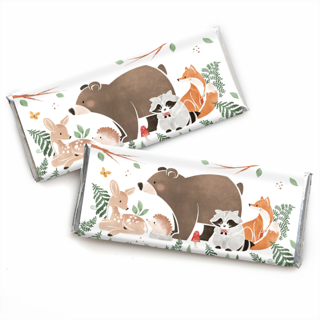Two candy bars with forest animal illustrations for a baby shower on a white background