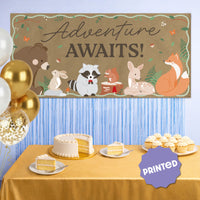 Adventure Awaits woodland banner styled at forest themed party