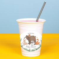 Plastic cup with animal illustrations and 'Katelyn's Baby Shower' text on a yellow and blue background