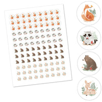 Sheet of animal stickers with circular insets showing fox, raccoon, bear, and deer designs.