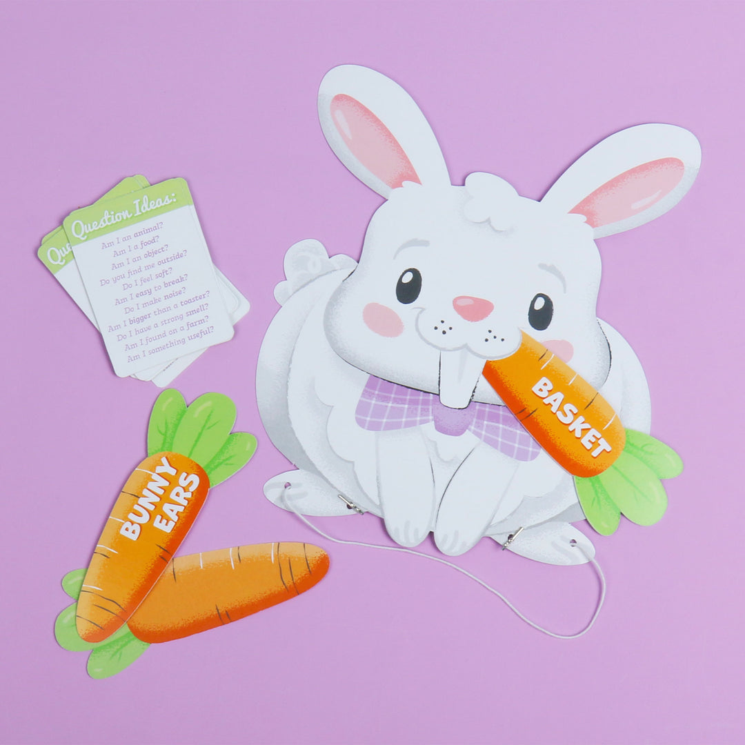 Easter-themed paper headbands guessing game with bunny ears, carrot, and basket on a purple background