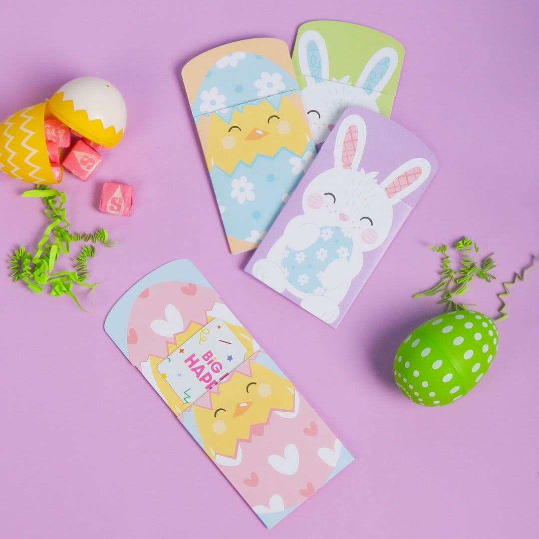 Colorful Easter-themed gift card holders on a purple background with decorative eggs and plants.