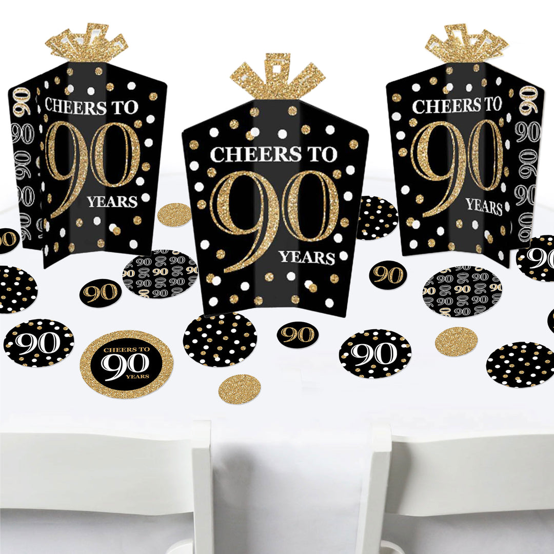 A set of birthday party decorations featuring black and gold colors with 'CHEERS TO 90 YEARS' text on them.