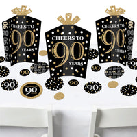 A set of birthday party decorations featuring black and gold colors with 'CHEERS TO 90 YEARS' text on them.