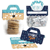 Clear plastic goodie bags with blue scalloped-edge topper labels featuring bowling ball and pins design, intended for birthday party or baby shower favors.