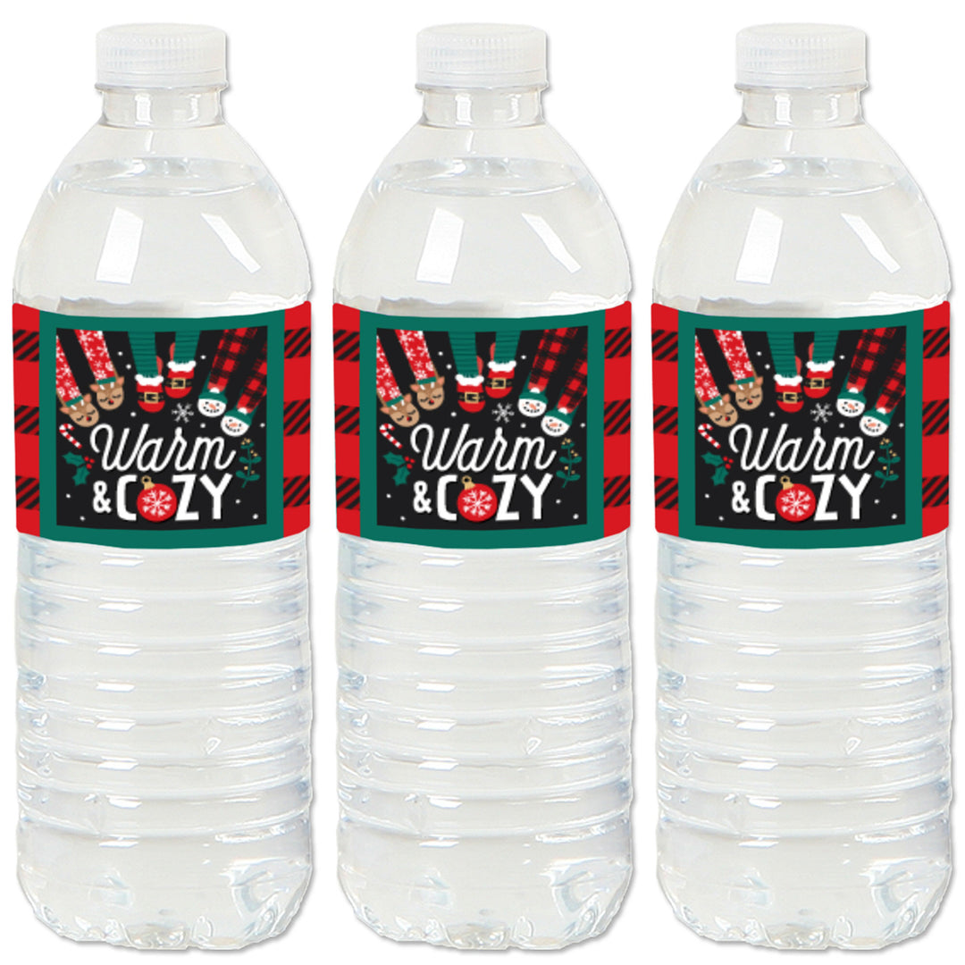 Three water bottles labels with Christmas-themed 'Warm & Cozy' text and plaid pattern labels.