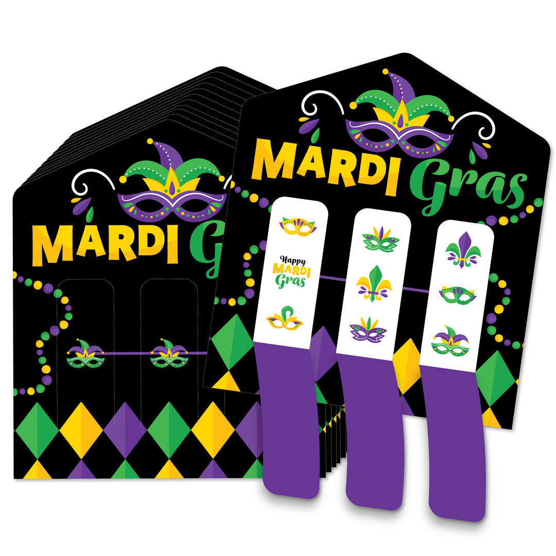 A set of colorful Mardi Gras mask themed pull tabs game cards displayed on a table with masks and festive designs.