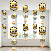 A set of construction-themed party decorations featuring various shaped pieces with a construction truck design, hanging from the ceiling.