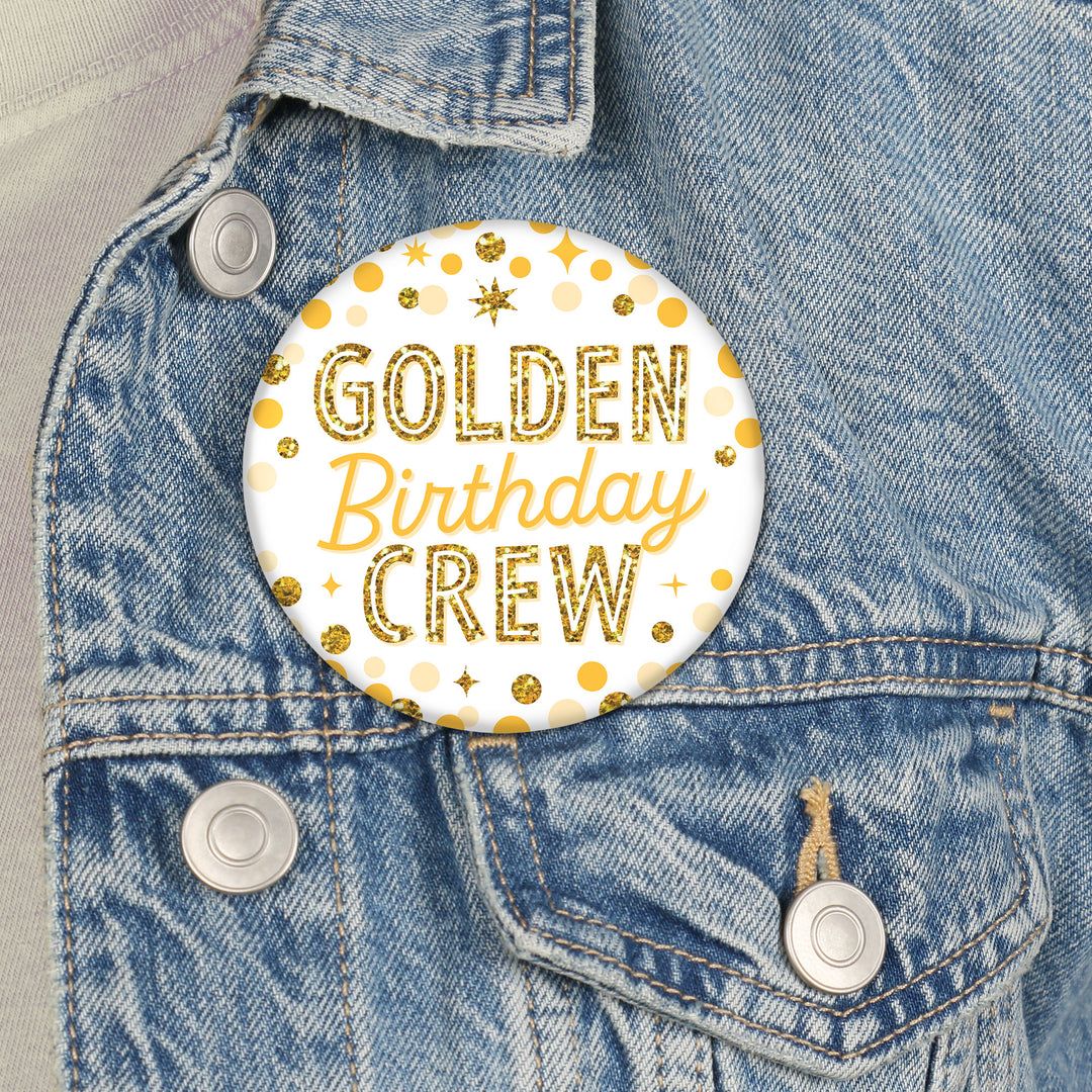 Golden Birthday buttons pinned on shirts and party favors