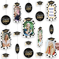 A graduation party photo display decoration kit featuring hanging vertical photo garland with cut-out shapes, including frames, circles, and caps, arranged with photos and text that reads 'Congrats GRAD'.