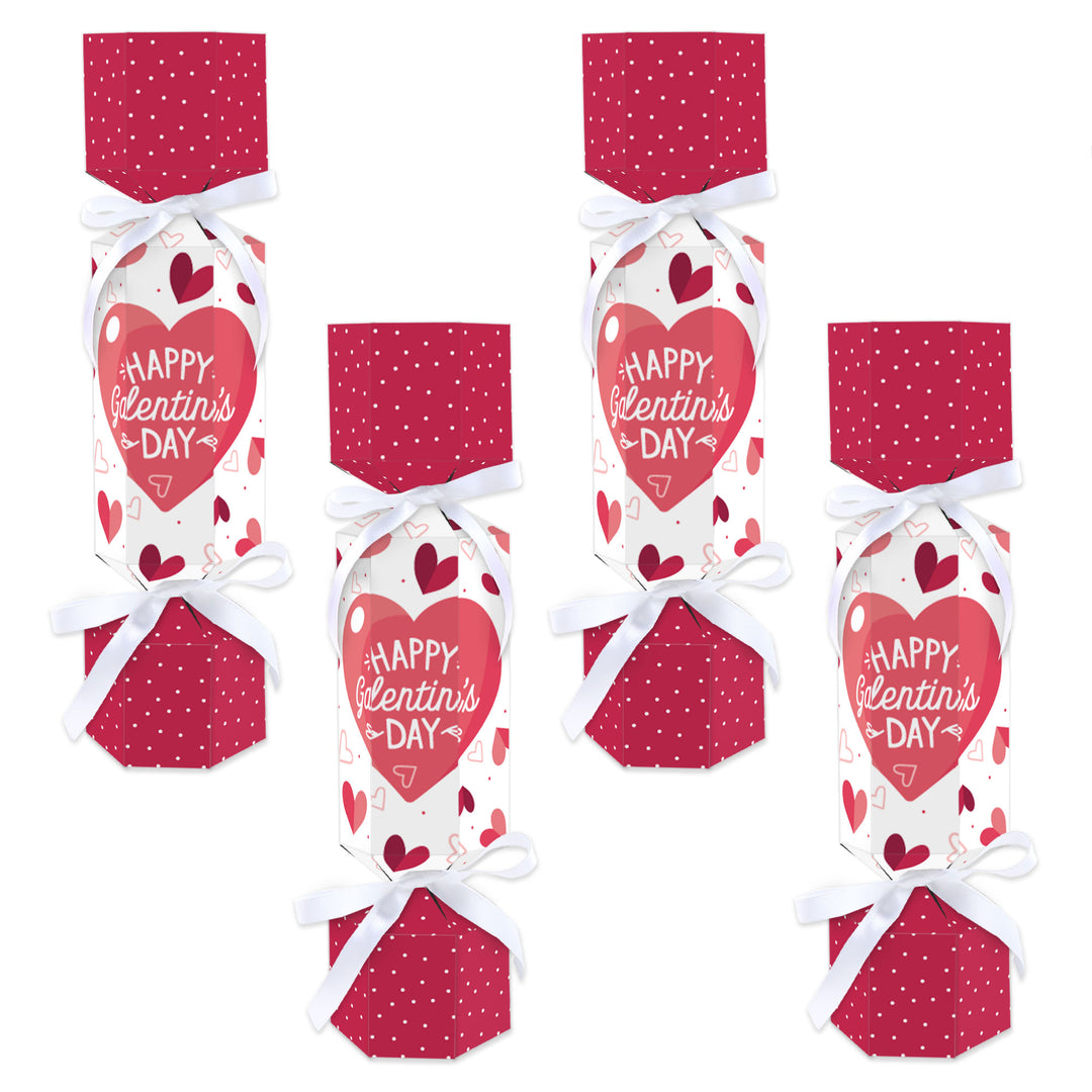 A set of six DIY Valentine's Day cracker boxes with 'Happy Galentine's Day' text and a pink color scheme, decorated with white satin ribbons and heart patterns.