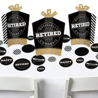 A set of retirement party decorations featuring three fold and flare centerpieces with a black and gold design, and a variety of round confetti pieces with different sizes, all themed 'Happy Retirement'.