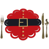 A round red paper charger with a scalloped edge and a central decorative belt buckle design, displayed with a fork on the left and a knife on the right.