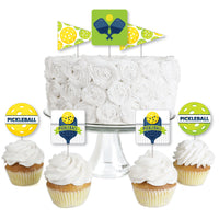 A set of dessert cupcake toppers with 'PICKLEBALL' text and green details, displayed on a cake and cupcakes.
