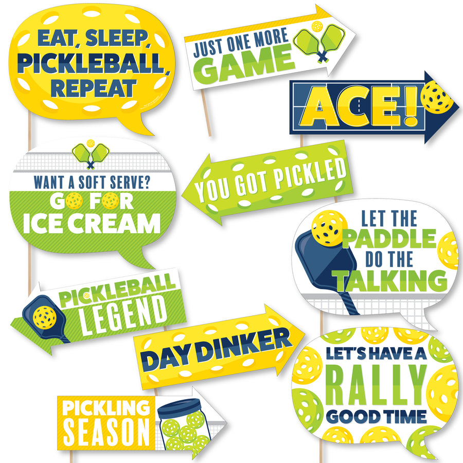 A set of colorful photo booth props themed around pickleball with phrases such as 'EAT, SLEEP, PICKLEBALL, REPEAT' and 'YOU GOT PICKLED'.