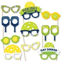 A collection of paper card stock photo booth props designed to look like various pickleball-themed glasses and accessories, ready for assembly.