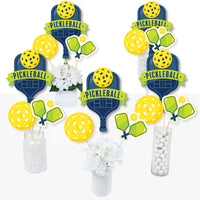 A set of centerpiece sticks with pickleball theme used for table decoration at a party.