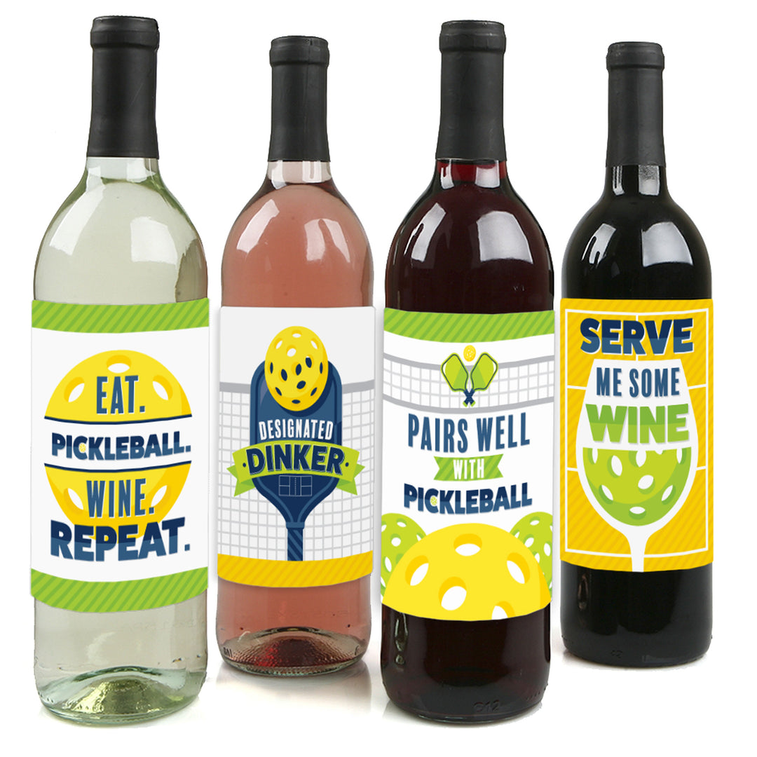 Four wine bottle labels with different pickleball-themed designs, including phrases such as 'EAT. PICKLEBALL.