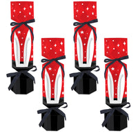 Four assembled DIY cracker boxes with red and white design, black ribbon, and star decorations.