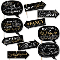 A set of 10 printed photo booth props with phrases related to masquerade parties, such as 'What Mask? Elegantly Ornate' and 'Glitz & Glam'.