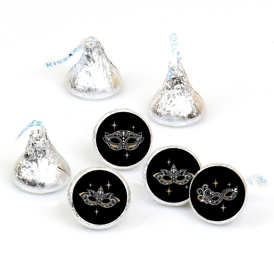 Round black candy stickers with a silver masquerade mask design, displayed on a white background.