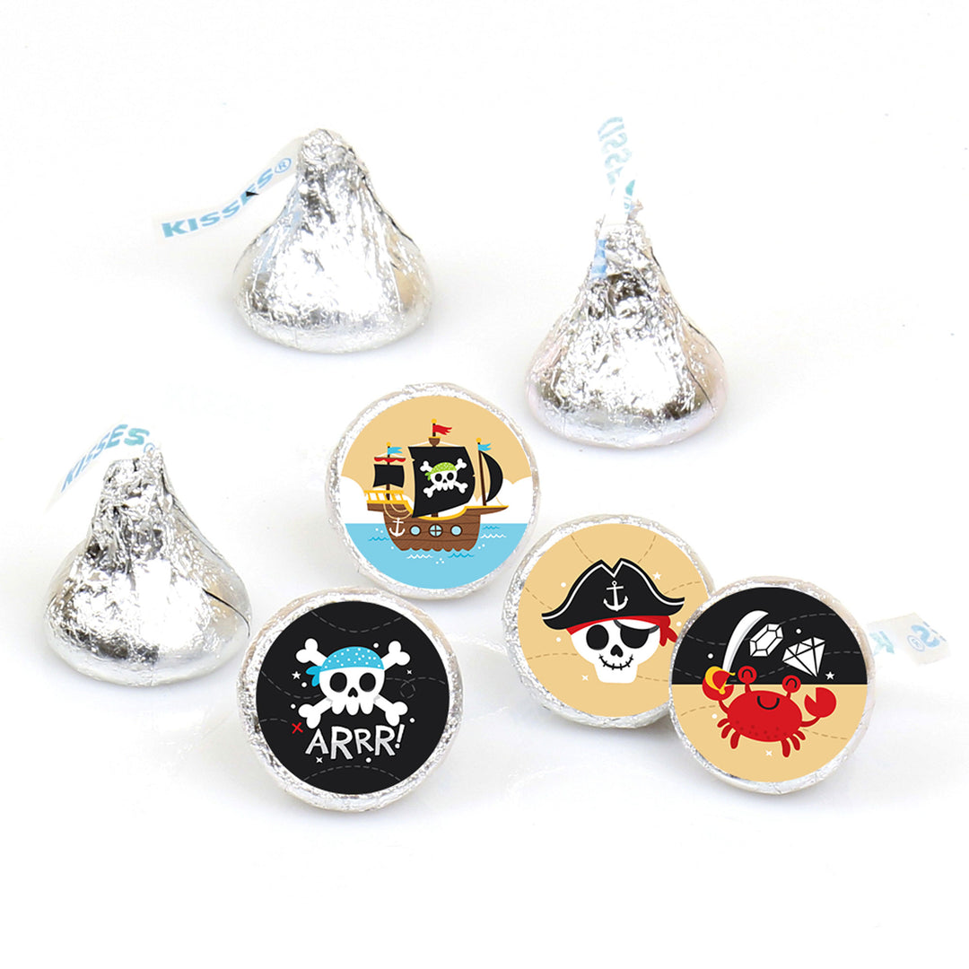A collection of round candy stickers with pirate ship designs, suitable for adorning chocolate candies for a birthday party.