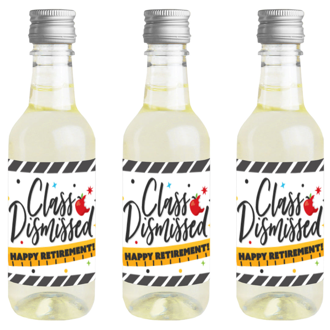 Three mini wine bottles with 'Class Dismissed' and 'Happy Retirement' labels attached to them.