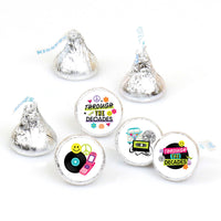 A collection of round candy stickers with various designs including text and vintage-style graphics, intended for use as party favors.