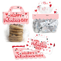 A set of flat Valentine's Day themed goodie bags with clear plastic treat bags and pink 'Happy Valentine's Day' scalloped-edge topper labels in two designs, displaying the to and from section.