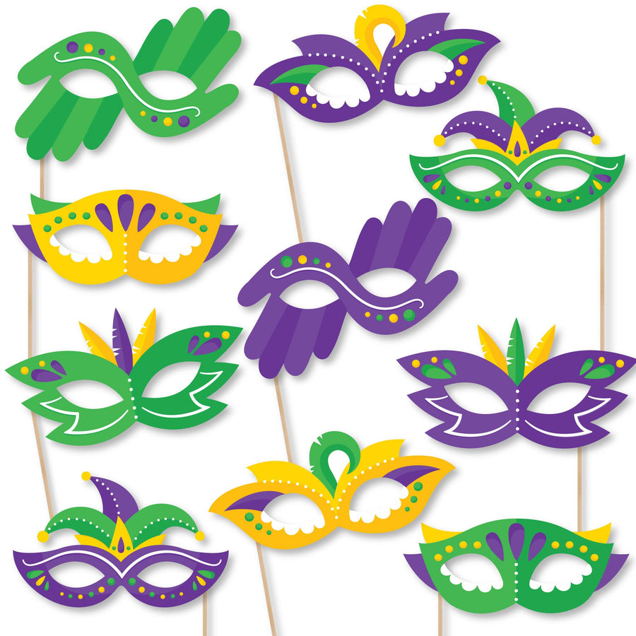 A collection of colorful, printed paper card stock masquerade party glasses photo booth props with black, gold, green, and purple designs.