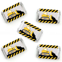 Mini candy bar wrappers with construction truck design, yellow and black striped pattern.