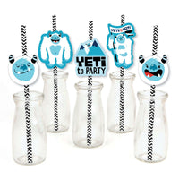 A set of decorative paper straws with blue yeti characters attached to them, displayed in front of clear drinking straws.