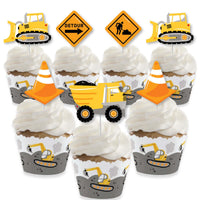 A set of cupcake decorations featuring construction theme elements, including wrappers and treat picks with construction vehicles and road signs.