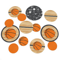 A collection of circular table confetti with basketball designs and other related sport-themed graphics in orange, black, white, and brown colors.