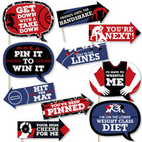 A set of 10 piece photo booth props kit with wrestling themes, including various prop signs and cut-outs with dowels for a wrestling or sports themed birthday party.